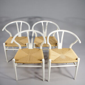 Hans J. Wegner for Carl Hansen, Denmark. "Wishbone chair" or "Y-chair". 8 chairs in painted beech and natural cord.