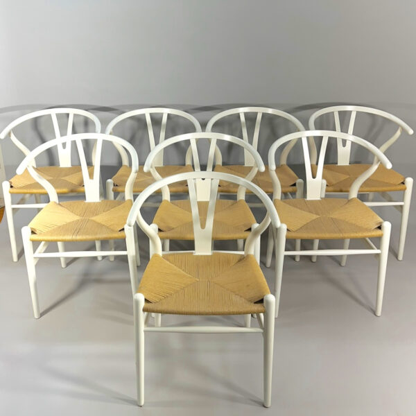 Hans J. Wegner for Carl Hansen, Denmark. "Wishbone chair" or "Y-chair". 8 chairs in painted beech and natural cord.