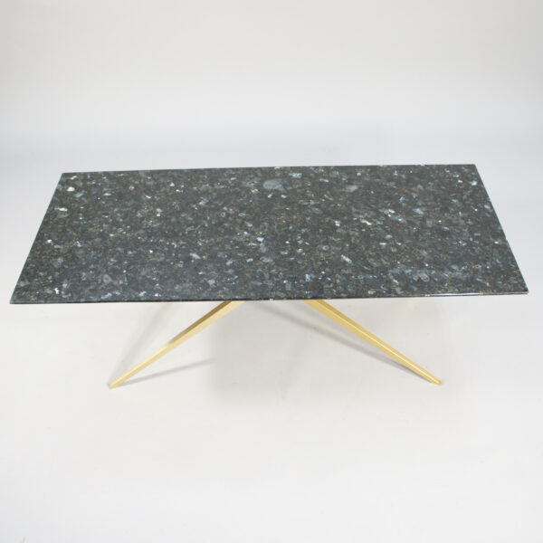 A 1950's coffee table in black granite and brass. d.