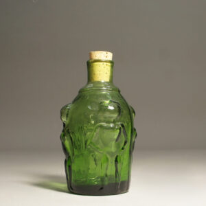 Erik Höglund for Boda, Sweden. Bottle with women in relief. Green glass.