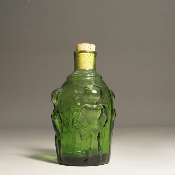Erik Höglund for Boda, Sweden. Bottle with women in relief. Green glass.