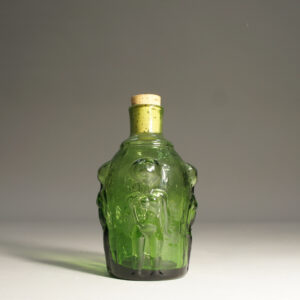 Erik Höglund for Boda, Sweden. Bottle with women in relief. Green glass.