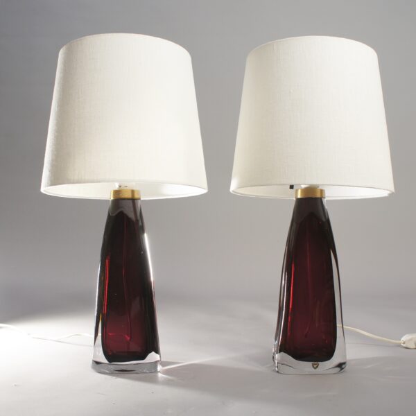 A pair of lamps in red glass by Carl Fagerlund for Orrefors, Sweden.