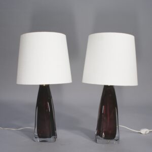 A pair of lamps in red glass by Carl Fagerlund for Orrefors, Sweden.