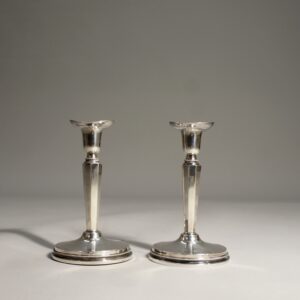 A pair of candle sticks in silver by Erik Löfman for MGAB, Sweden.