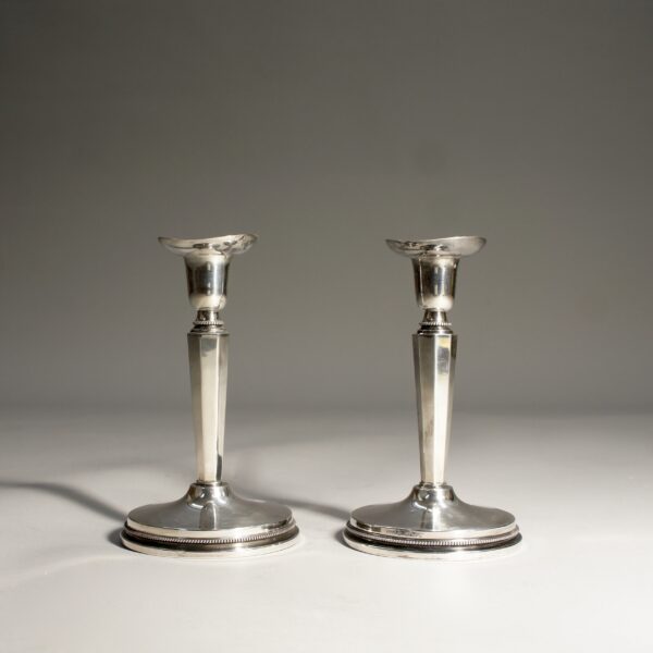 A pair of candle sticks in silver by Erik Löfman for MGAB, Sweden.
