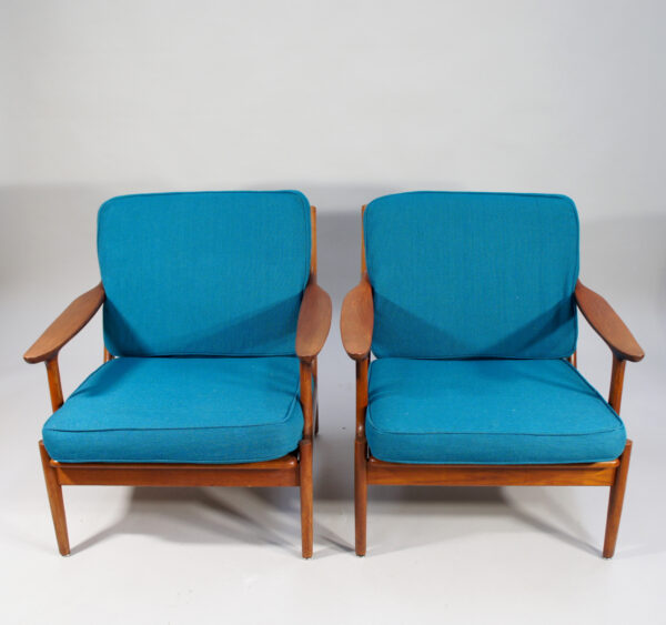 Bramin, Denmark. A pair of easy chairs in teak with new upholstering. Denmark