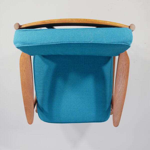 A pair of reupholstered easy chairs in teak by Bramin, Denmark.