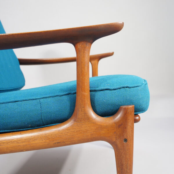 A pair of reupholstered easy chairs in teak by Bramin, Denmark.