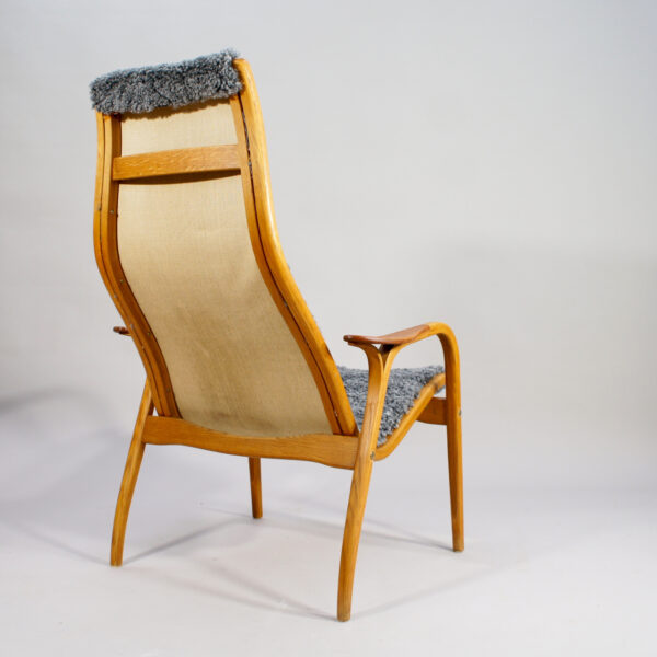 Yngve Ekström for Svedese, Sweden. "Lamino" 1950's easy chair in oak, teak and reupholstered in grey sheep skin.
