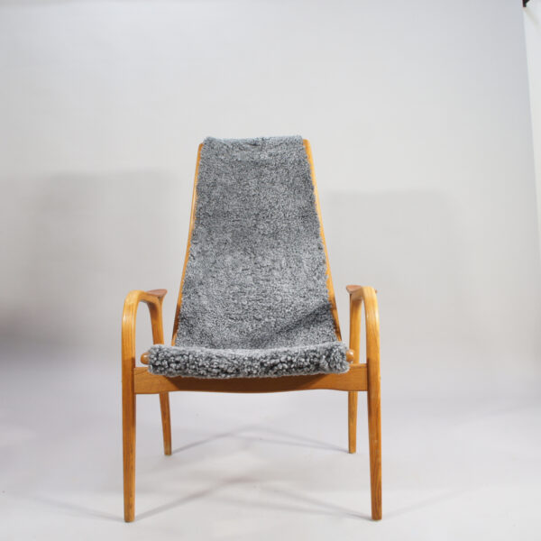 Yngve Ekström for Svedese, Sweden. "Lamino" 1950's easy chair in oak, teak and reupholstered in grey sheep skin.