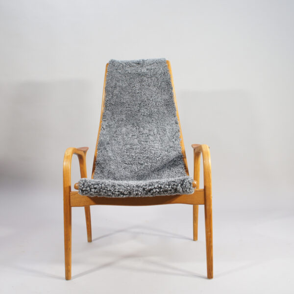 Yngve Ekström for Svedese, Sweden. "Lamino" 1950's easy chair in oak, teak and reupholstered in grey sheep skin.