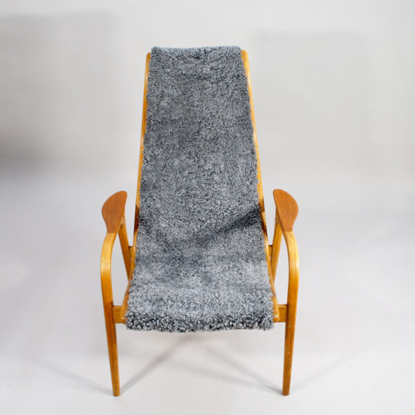 Yngve Ekström for Svedese, Sweden. "Lamino" 1950's easy chair in oak, teak and reupholstered in grey sheep skin.
