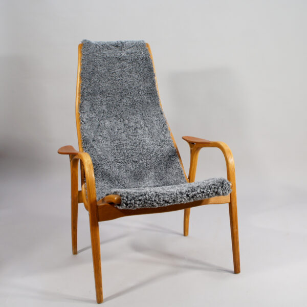 Yngve Ekström for Svedese, Sweden. "Lamino" 1950's easy chair in oak, teak and reupholstered in grey sheep skin.