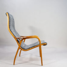 Yngve Ekström for Svedese, Sweden. "Lamino" 1950's easy chair in oak, teak and reupholstered in grey sheep skin.