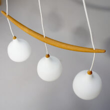 1960's ceiling lamp in oak and glass by Luxus Sweden. "The banana".