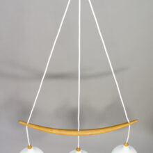 1960's ceiling lamp in oak and glass by Luxus Sweden. "The banana".