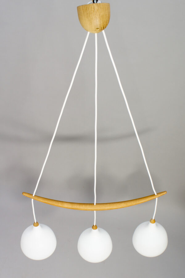1960's ceiling lamp in oak and glass by Luxus Sweden. "The banana".