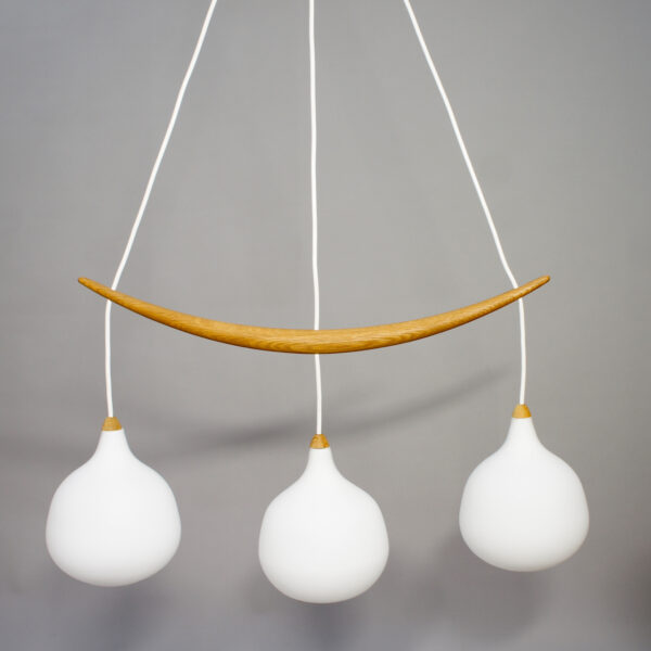1960's ceiling lamp in oak and glass by Luxus Sweden. "The banana".