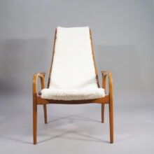 Yngve Ekström for Svedese, Sweden. "Lamino" 1950's easy chair in oak, teak and reupholstered in white sheep skin.
