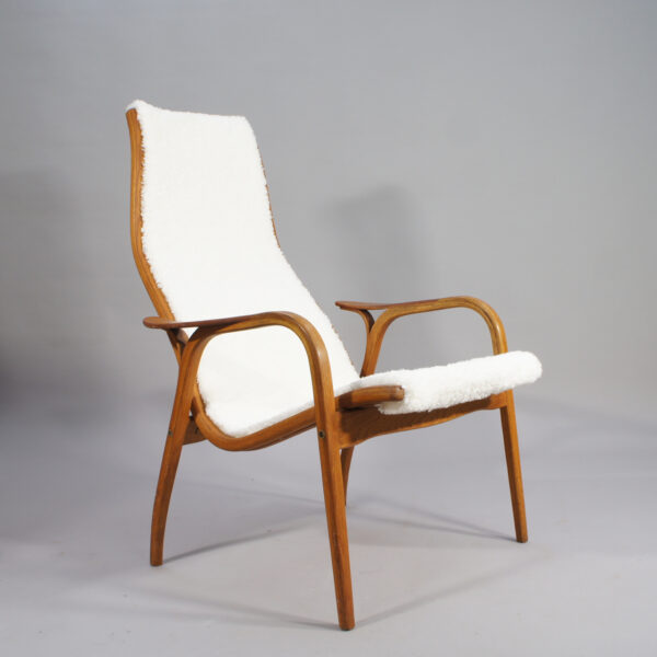 Yngve Ekström for Svedese, Sweden. "Lamino" 1950's easy chair in oak, teak and reupholstered in white sheep skin.