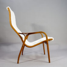 Yngve Ekström for Svedese, Sweden. "Lamino" 1950's easy chair in oak, teak and reupholstered in white sheep skin.