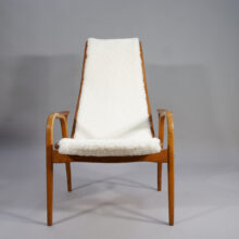 Yngve Ekström for Svedese, Sweden. "Lamino" 1950's easy chair in oak, teak and reupholstered in white sheep skin.