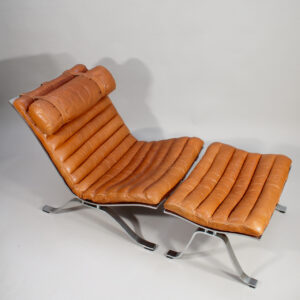 Ari. Easy chair in steel and leather with ottoman by Arne Norell, Sweden.