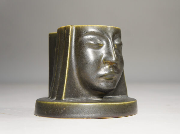 Ceramic candle holder with face in art deco style