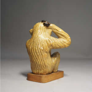 1940-50's sculptural ceramic monkey on wooden base