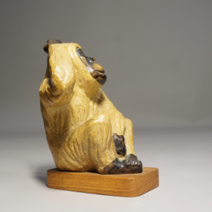 1940-50's sculptural ceramic monkey on wooden base