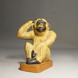 1940-50's sculptural ceramic monkey on wooden base