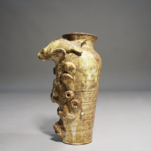 Ceramic vase with fish decorations by Christopher Crete.