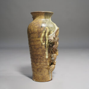 Ceramic vase with fish decorations by Christopher Crete.