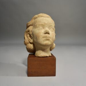 Cereamic sculpture of young girl on base of wood