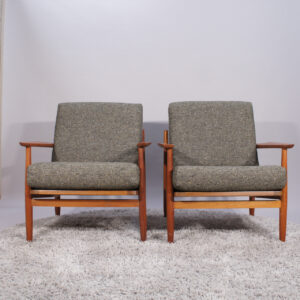 A pair of 1960's chairs in teak with new reupholstered seats.