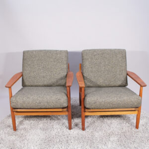 A pair of 1960's chairs in teak with new reupholstered seats.