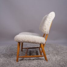 Alf Svensson for Dux, Sweden. "TeVe". Easy chair in beech with lamb skin. "TeVe"-stolen av Alf Svensson för Dux.