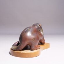 Gunnar Nylund for Rörstrand. 1950's signed Mink in stoneware on base in wood. Minkfigurin av Gunnar Nylund