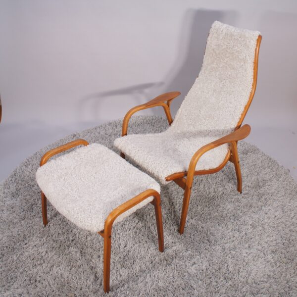 Yngve Ekström for Svedese, Sweden. “Lamino”. 1956 easy chair in oak and teak reupholstered in sheep skin.