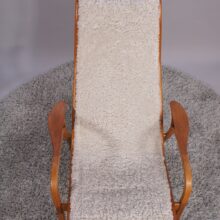 Yngve Ekström for Svedese, Sweden. “Lamino”. 1956 easy chair in oak and teak reupholstered in sheep skin.