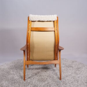 Yngve Ekström for Svedese, Sweden. “Lamino”. 1956 easy chair in oak and teak reupholstered in sheep skin.