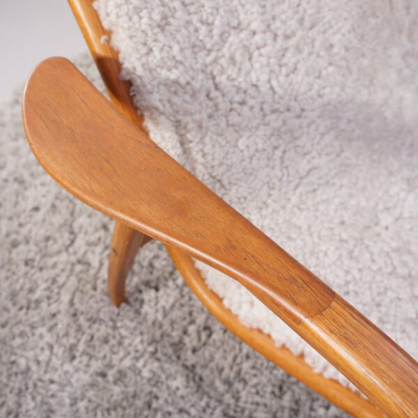 Yngve Ekström for Svedese, Sweden. “Lamino”. 1956 easy chair in oak and teak reupholstered in sheep skin.