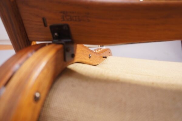 Yngve Ekström for Svedese, Sweden. “Lamino”. 1956 easy chair in oak and teak reupholstered in sheep skin.