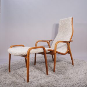 Yngve Ekström for Svedese, Sweden. “Lamino”. 1956 easy chair in oak and teak reupholstered in sheep skin.