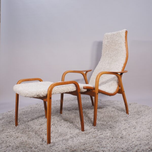 Yngve Ekström for Svedese, Sweden. “Lamino”. 1956 easy chair in oak and teak reupholstered in sheep skin.