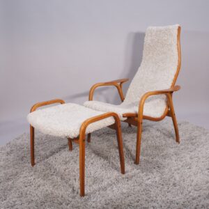 Yngve Ekström for Svedese, Sweden. "Lamino". 1956 easy chair and ottoman in oak and teak reupholstered in sheep skin. Wood refinished.